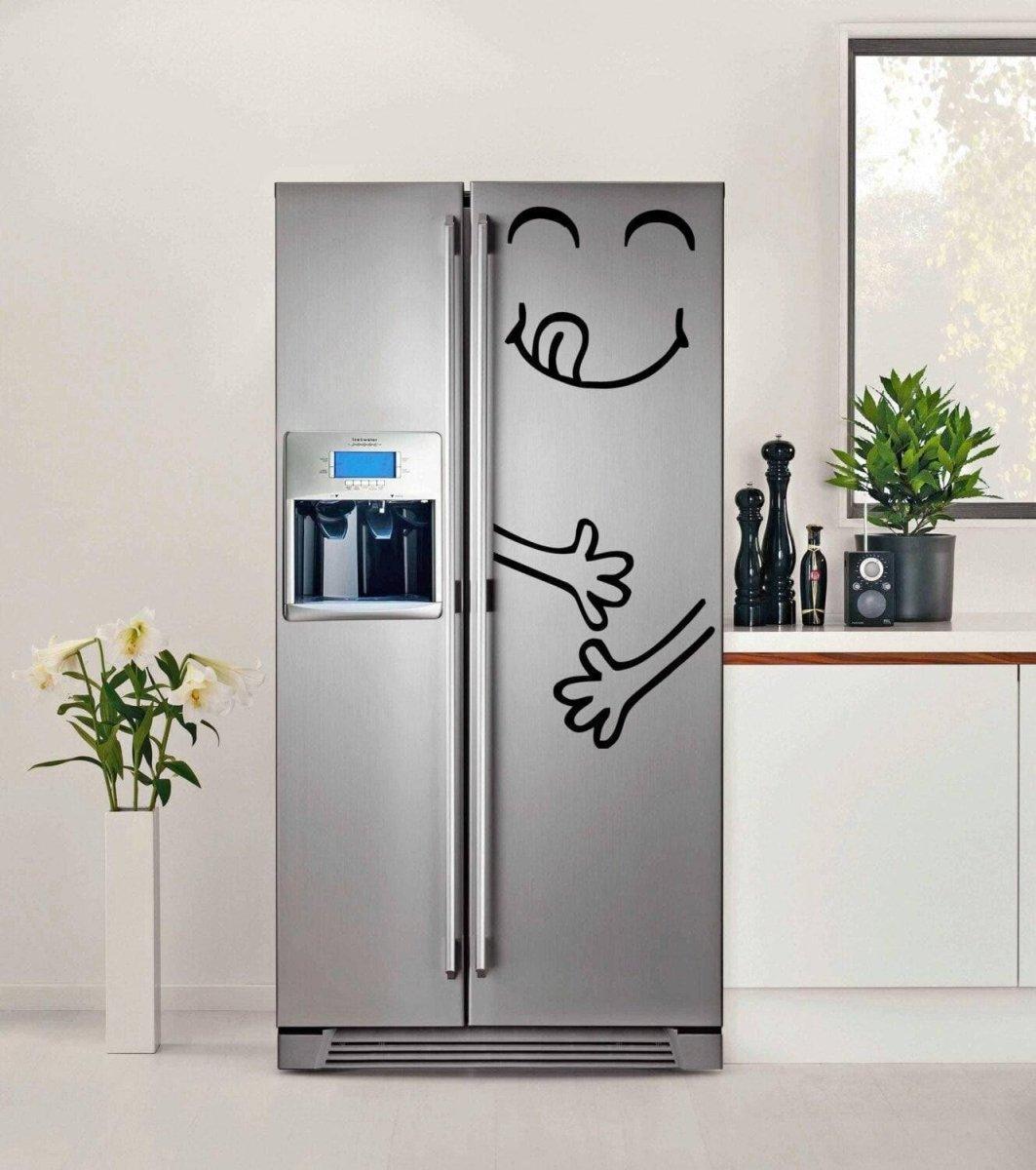 Playful vinyl die cut sticker of a smiling face on a modern kitchen fridge, adding fun decor to the space.