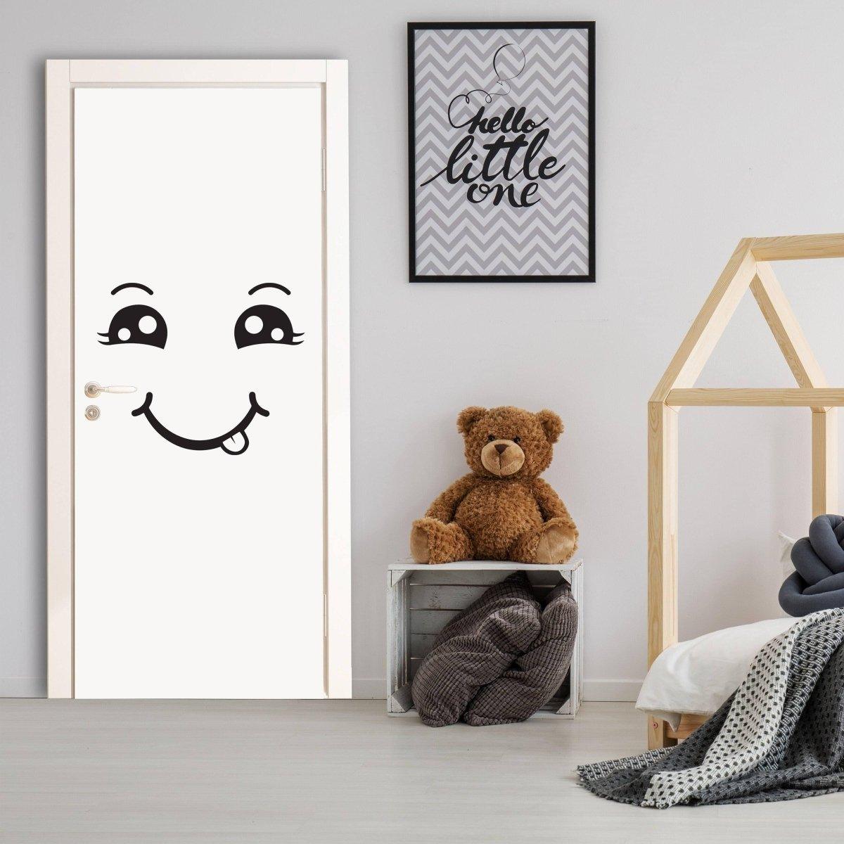 Happy face door decal in a stylish room with teddy bear and wall art. Bright, cheerful decor for kids' spaces.