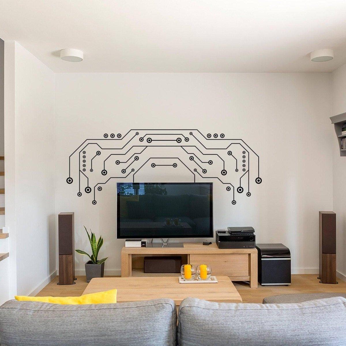 TV wall decor featuring large black vinyl circuit design above a modern living room setup with a sleek TV.