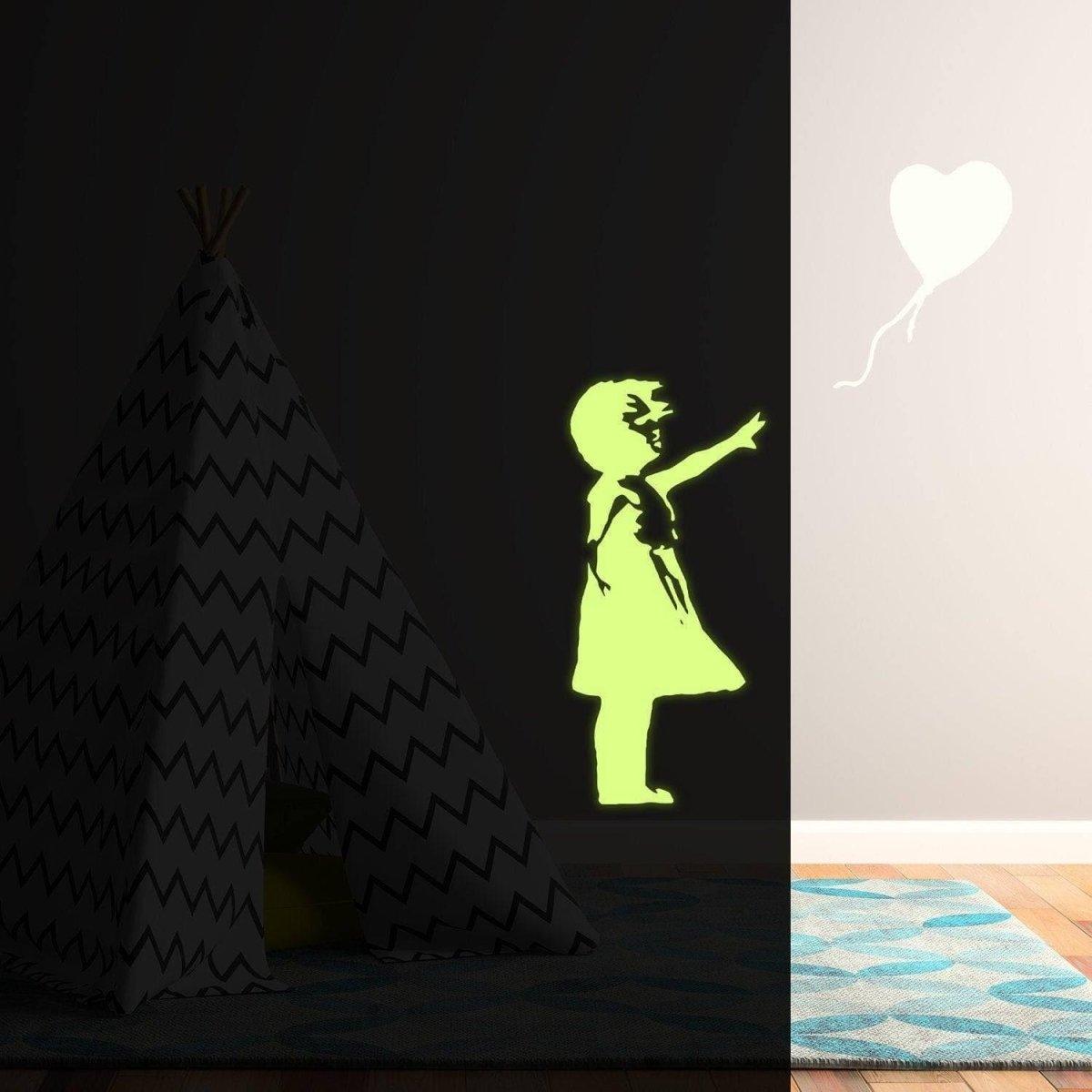 Luminescent wall decal of a girl pointing at a glowing heart balloon in a cozy room with a teepee.