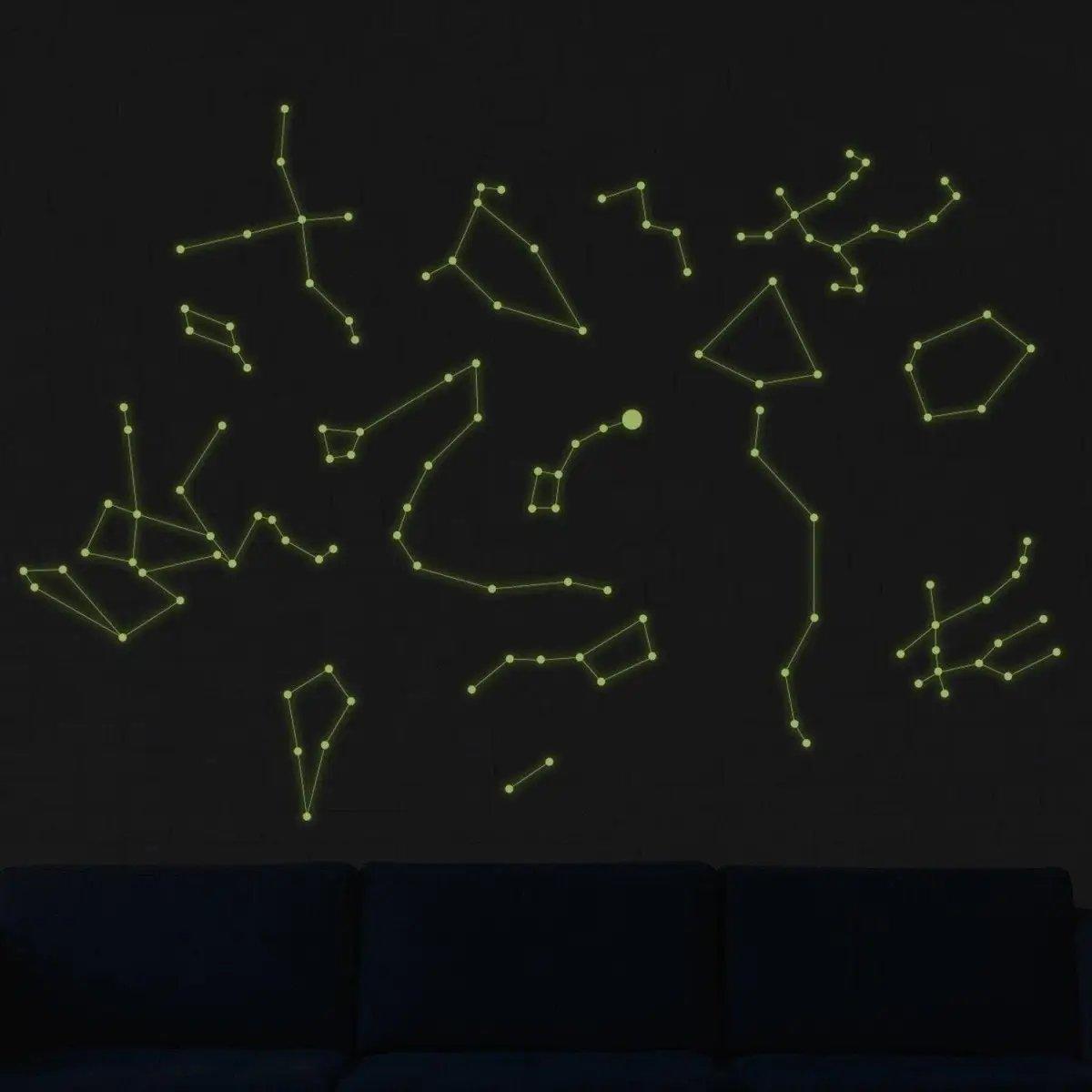 Luminous constellation wall decals glowing against a dark background, perfect for a starry sky ceiling decor.
