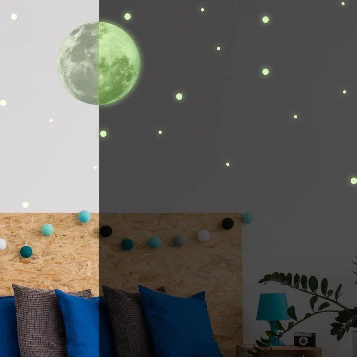 Glow in the dark moon and stars wall decals in a child's bedroom for magical home decor.