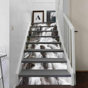Staircase decorated with waterfall vinyl sticker decals enhancing home decor with artistic design.