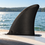 Illustrative lakeside view of the black replacement paddleboard fin on an inverted SUP board