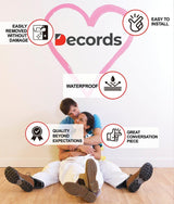 Couple sitting on the floor with wall decals displaying features like waterproof and easy to install.