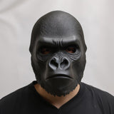 Front view of a 3D printed gorilla face mask worn by a person, showing realistic sculpted fur texture and matte black finish against a neutral background.