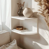 3D printed corner wall shelf in matte white PLA, mounted above a sofa with natural light and dried flowers, minimalist modern home decor accessory