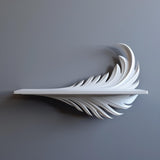 3D printed white wall shelf with a sculptural feather-shaped support beneath a slim ledge, mounted on a smooth grey wall in soft natural light.