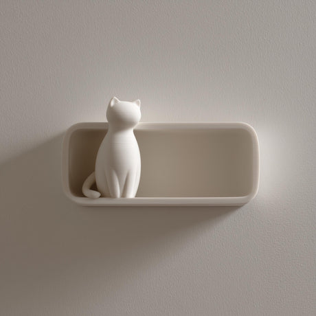 3D printed wall shelf with a slim rounded tray and a minimalist sitting cat figure at one end, made from matte PLA plastic on a light wall.