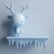 3D printed wall shelf with a smooth icicle-edge ledge and a small antlered character standing on top, mounted on a light-colored wall.