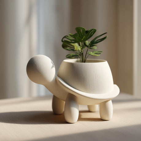 3D printed turtle shaped planter with an open shell used as a small pot on a wooden table in soft daylight.