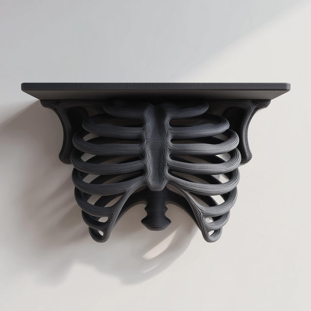 3D printed matte black PLA wall shelf with a realistic ribcage and spine forming the support under a flat rectangular ledge.