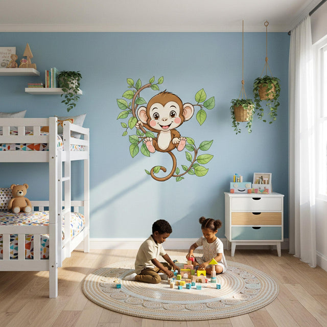 A cheerful cartoon monkey with brown fur and rosy cheeks smiling while hanging from a leafy green vine, designed as a vinyl wall decal for a children's room.