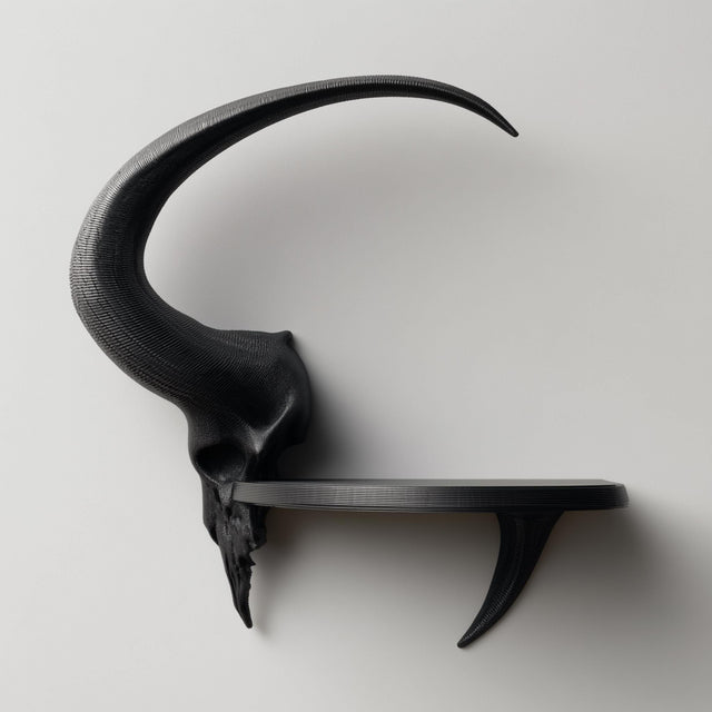 3D printed matte PLA wall shelf with a stylized ram skull and long curved horn supporting a small floating ledge on a light-colored wall.