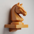 3D printed wall-mounted shelf featuring a chess knight horse head rising from a compact floating ledge, designed as strategy-themed wall decor.