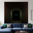 A vertical 3D wall decal showing a long, dark hallway with red brick walls and floor. At the far end of the dark, shadowy corridor, two glowing green eyes are visible, staring forward from the blackness.