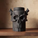 3D printed dark fantasy pet cremation urn shaped as a horned skull, gothic memorial decor displayed on a wooden shelf.