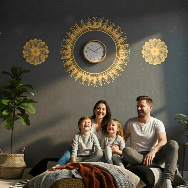 A horizontal arrangement of three golden-yellow designs on a light background. The center features a large, sharp-edged sunburst or sun symbol, with two smaller, intricate floral mandalas on either side.