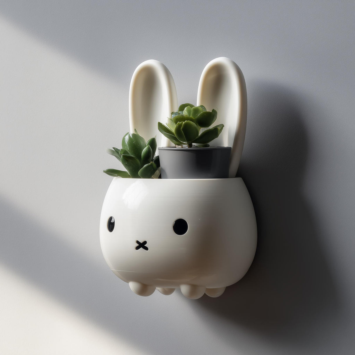 3D printed cute bunny wall shelf with small integrated planter compartment, mounted on a soft neutral interior wall.