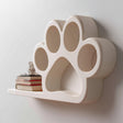 3D printed paw print shaped wall shelf with integrated small display platform, mounted on a light minimalist interior wall.