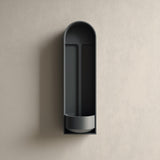 3D printed arched niche wall shelf with a tall recessed alcove and a small built-in bowl tray at the bottom, minimalist design mounted on a textured wall.