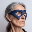 3D printed avant-garde mask glasses style eye mask with large oval eye cutouts and angular side panels, worn in a studio portrait on a neutral background.