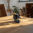 Alternate product view of the sculpted character wine bottle holder.