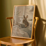 Mini Rex Rabbit Reading in Bed Poster | Scandinavian Gouache Bunny Wall Art | Warm Beige Oat Milk Decor | Cozy Nordic Bedroom Print