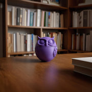 3D printed minimalist owl memorial urn featuring a round owl with closed eyes and simplified feather design