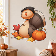 Smiling brown turtle wall decal with a pilgrim-style hat, orange pumpkin and scattered rust, gold and red autumn leaves.