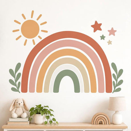 Terracotta, peach and mustard rainbow wall decal with a small sun, four stars and sage-green leafy sprigs.