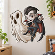 Smiling cartoon vampire with black hair and a red-lined cape floating beside a large cream-colored ghost.