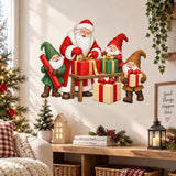 Holiday wall art with Santa, three smiling Christmas gnomes and brightly wrapped presents.