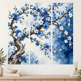 Three-panel blossom tree wall decal with twisting dark branches, blue and white flowers and a pale watercolor-style background.