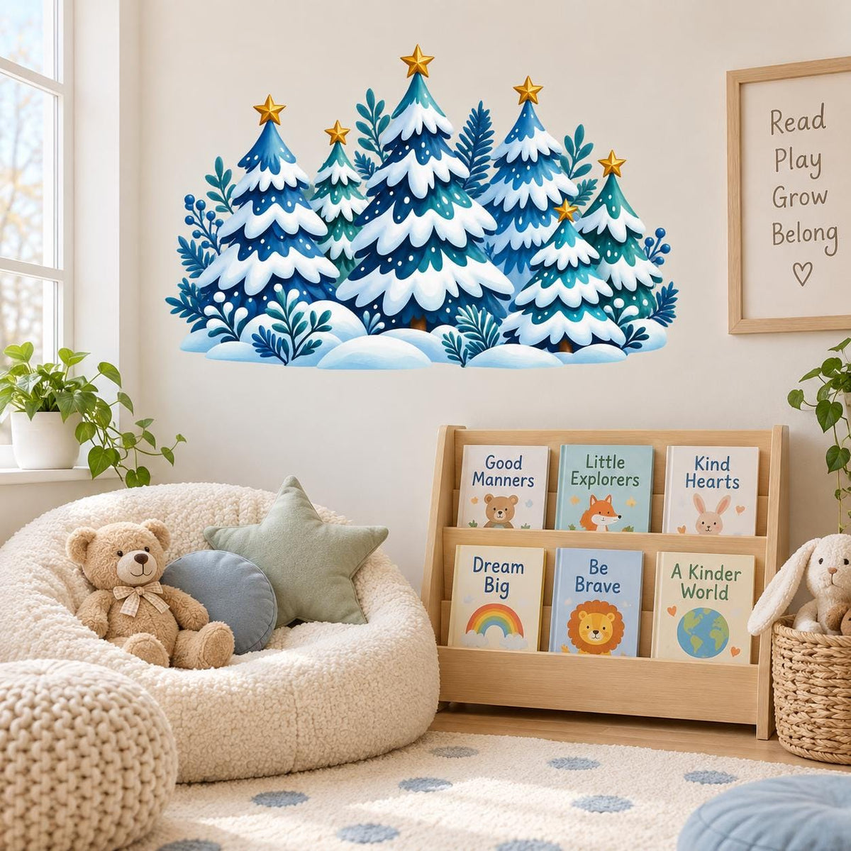 Snowy evergreen forest wall decal with blue and teal trees, gold stars and berry branches above a sofa.