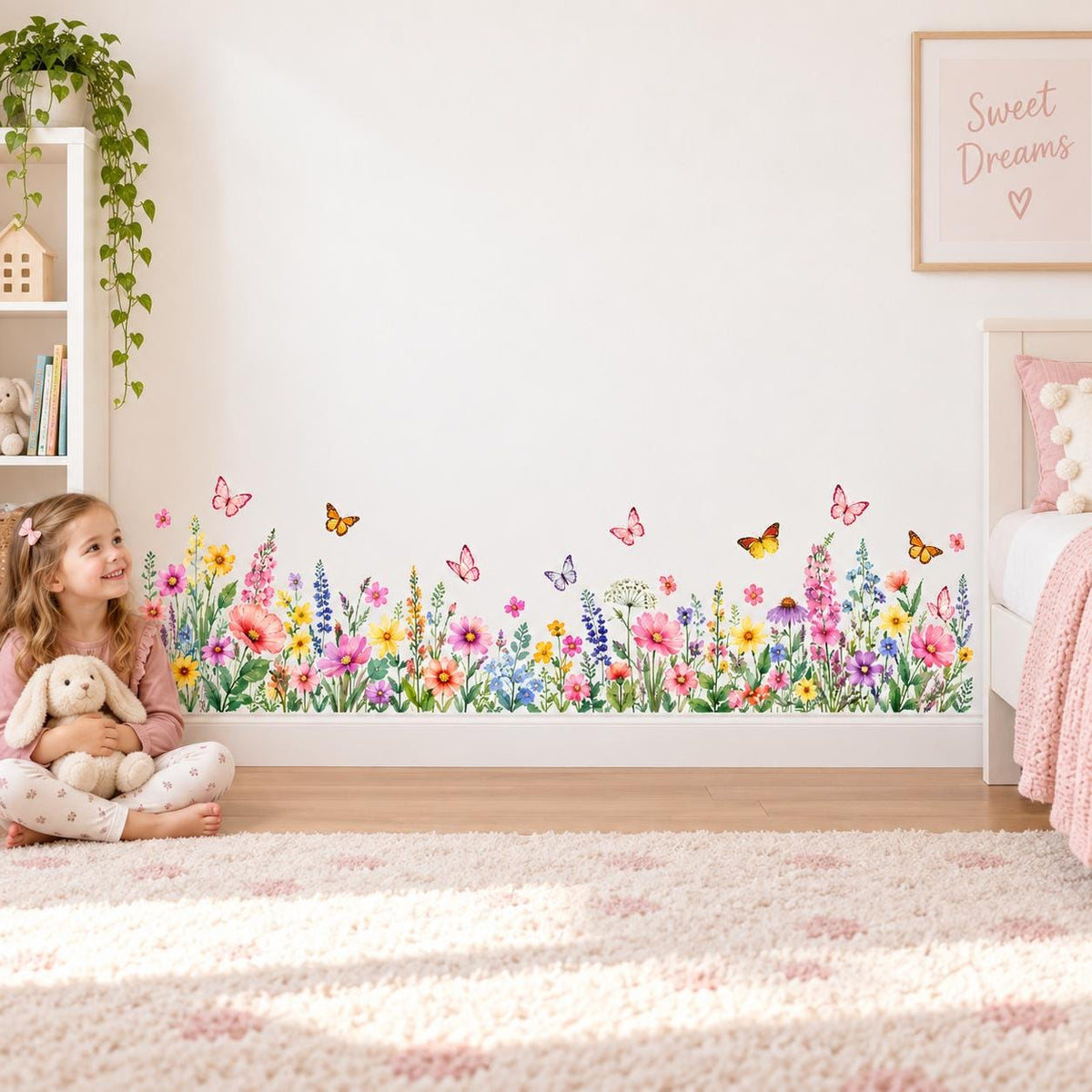 Watercolor flower border wall decal showing mixed wildflowers and butterflies at the bottom of a room wall.