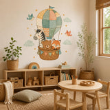 Animal hot air balloon wall sticker featuring a zebra, bear and fox with birds and pale green clouds.