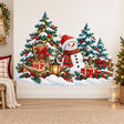 Snowman in a red hat and striped scarf beside a Christmas tree, snowy evergreens, gifts, a sled, lantern and rustic fence.