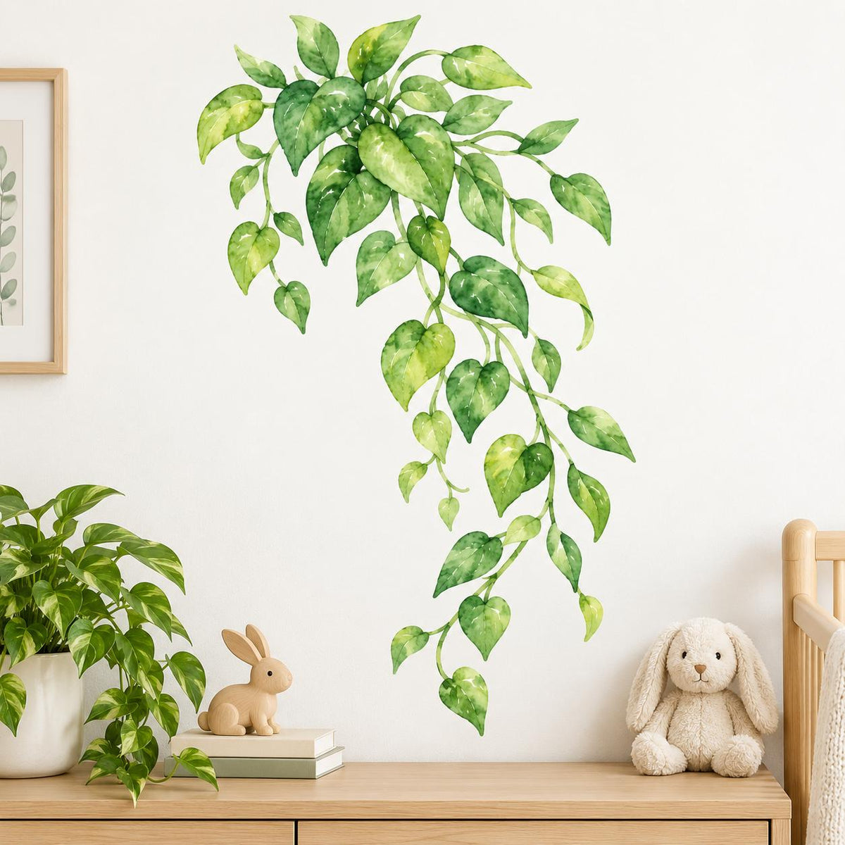 Cascading watercolor vine wall decal with heart shaped and oval leaves in deep green, lime and yellow green.
