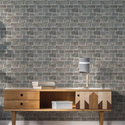 Flat printed stone-effect vinyl wall mural in a stylish living room setting, showcasing modern home decor and design.
