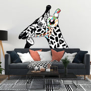 Contemplative giraffe wall sticker with colorful headphones on white wall above modern sofa.