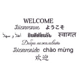Multilingual welcome sign sticker with various greetings in cursive fonts for home decor.