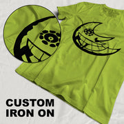 Custom iron on transfer t-shirt with unique black design on vibrant green fabric.