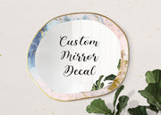 Custom mirror decal on a stylish mirror with colorful edges.