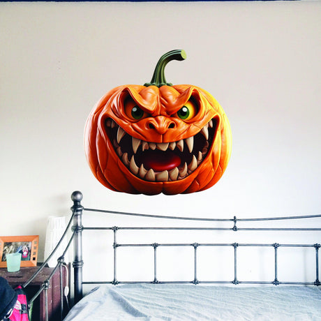 Large orange pumpkin-face wall decal with a dimensional broken-wall effect.