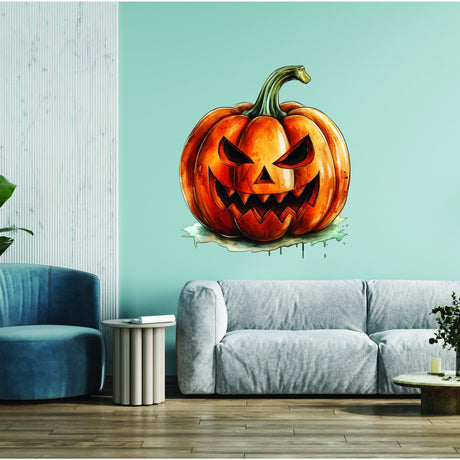 Orange smiling pumpkin-face vinyl wall decal displayed on a teal wall.