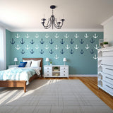 Vintage anchor wall decals in a stylish bedroom, showcasing a nautical theme with blue and white designs.